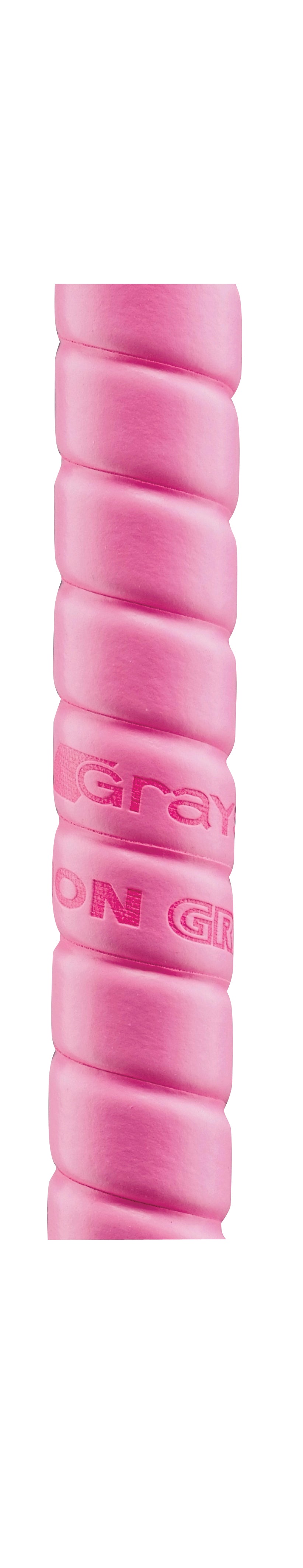 Close-up of the Grays Cushion Grip by Grays in pink, showing its ribbed, cylindrical design with grooves and partial raised text for ultra non-slip performance, set against a white background.
