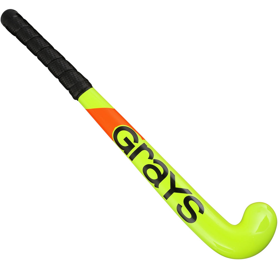 The Grays Replica 18 inch Hockey Stick features a bright yellow design with a black handle grip, bold "Grays" branding along the shaft, and an orange accent near the handle for standout style on the field.