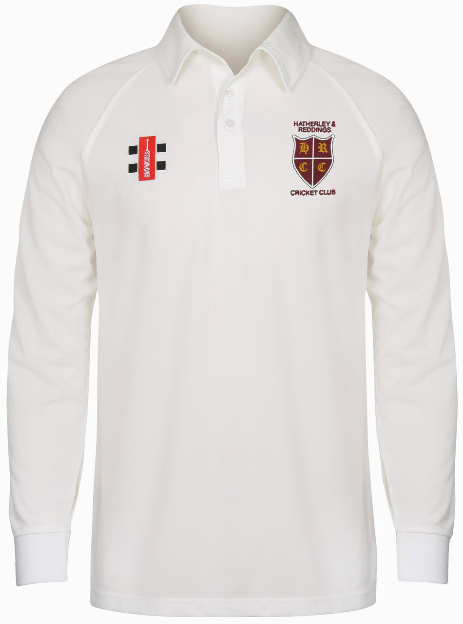 The Gray Nicolls Hatherley & Reddings CC Matrix V2 Long Sleeve Shirt in white has a collared, buttoned design, plus two chest badges: a red, black, and white rectangle and the Hatherley & Reddings Cricket Club crest.