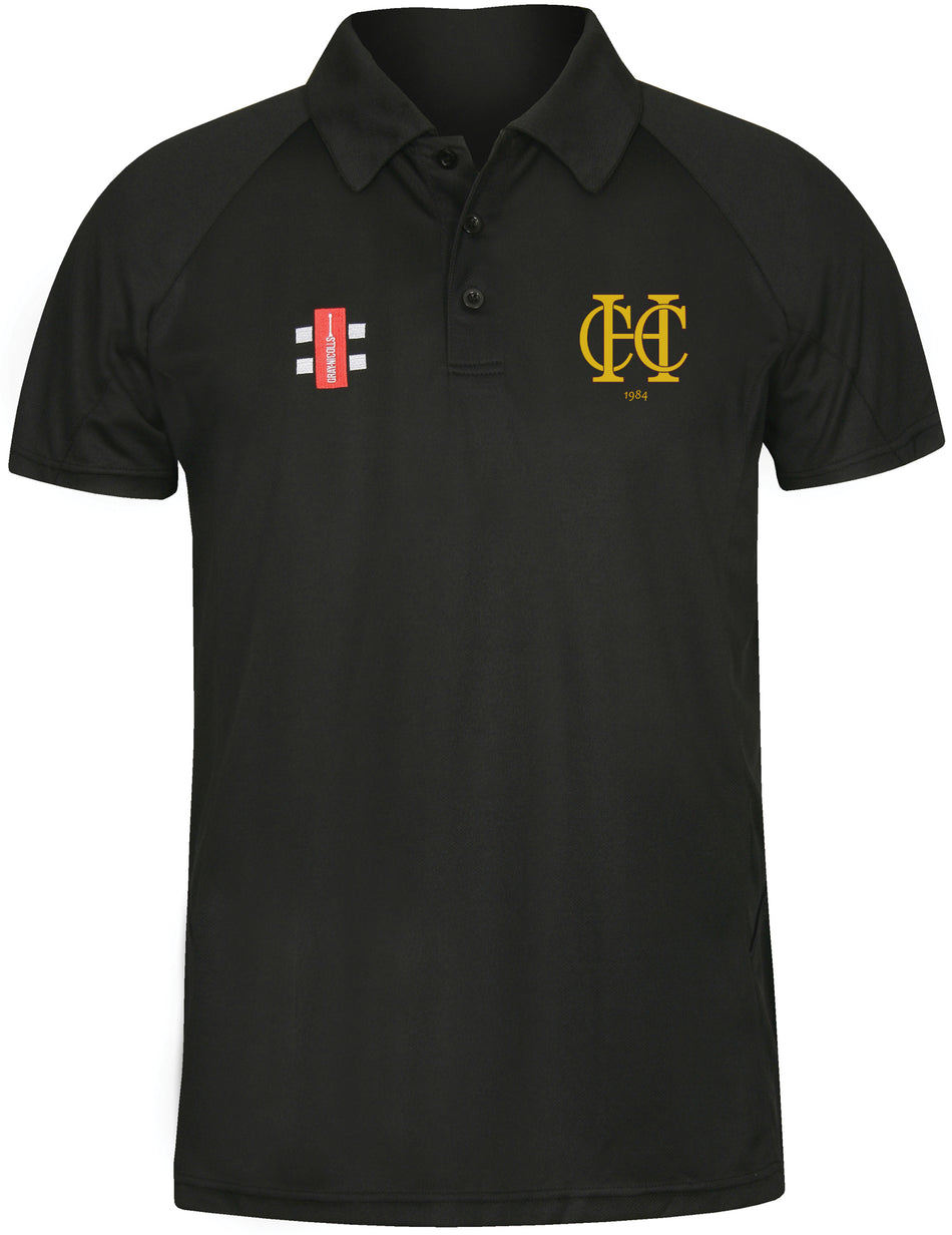 The Gray Nicolls Hawkesbury Upton CC Matrix V2 Junior Polo Shirt is a navy short-sleeve polo with a collar, ideal for active training. It features moisture management, a gold "C C" logo on the left chest, and a red and white rectangular logo on the right chest.