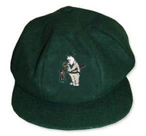 The Hillesley CC Traditional Cap by Martin Berrill Sports is a green cap with a club logo and an image of a golfer beside a golf bag, holding a club.