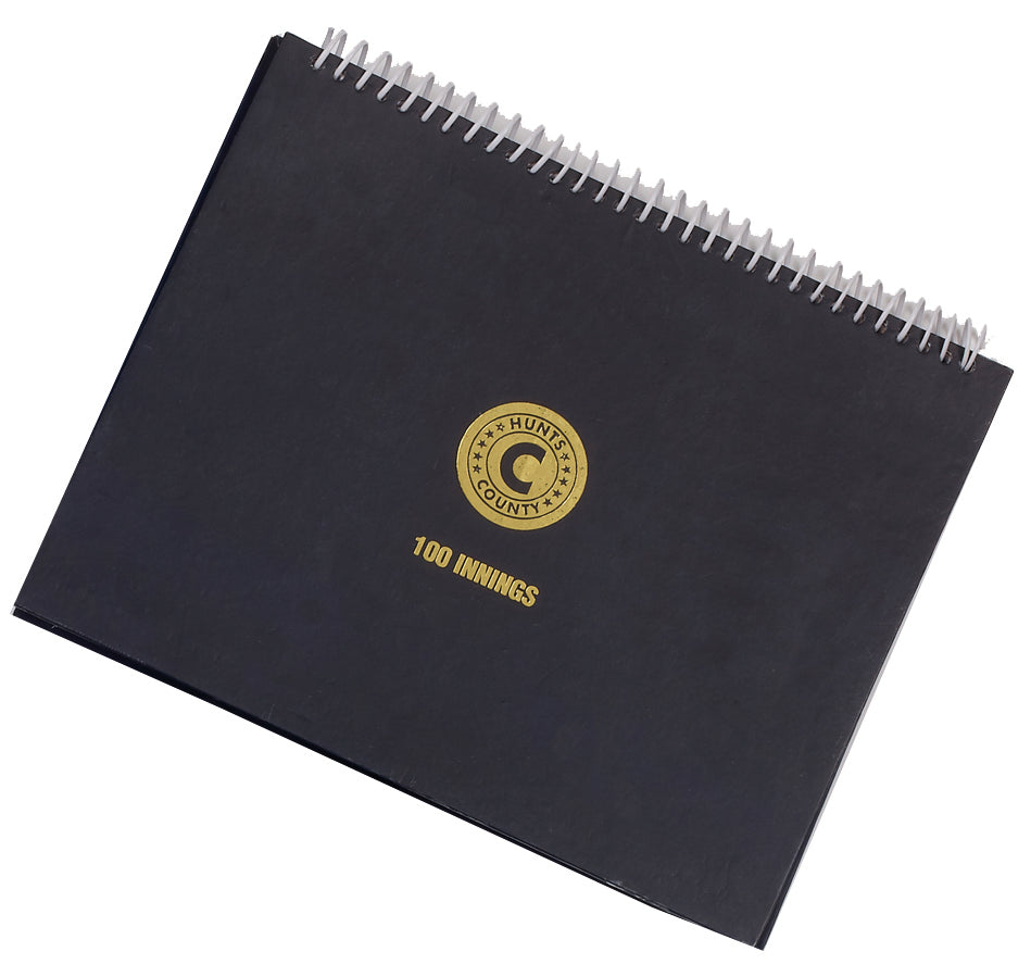 The Hunts County 100 Innings Scorebook is a black wire-bound scorebook featuring a gold "COUNTY HUNT" emblem and "100 INNINGS" below, perfect for recording school club matches.