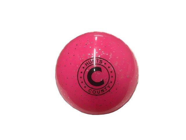 The Hunts County Glitter Ball is a bright pink, glittery PVC training ball with “Hunts County” and a large black “C” printed on it, shown against a plain white background.