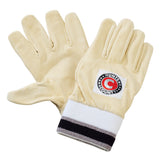 A pair of Hunts County Full Chamois Inners in beige, featuring dark and light striped toweling cuffs and a circular "HUNTS COUNTY" patch on the back of one glove, displayed on a white background.