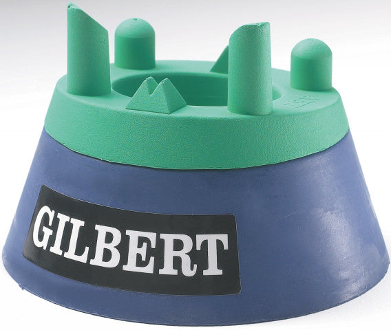 The Gilbert Adjustable Kicking Tee by Gilbert features raised grip points for optimal kicking practice, with a green and blue design and a black and white Gilbert logo on the front.