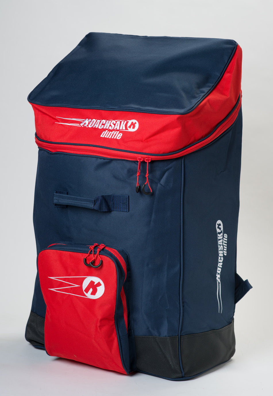 The Katchet KoachSak Duffle is a large navy blue and red sports backpack with top zipper, front pocket, rucksack handles, and white branding. Its water-resistant design keeps your gear protected.