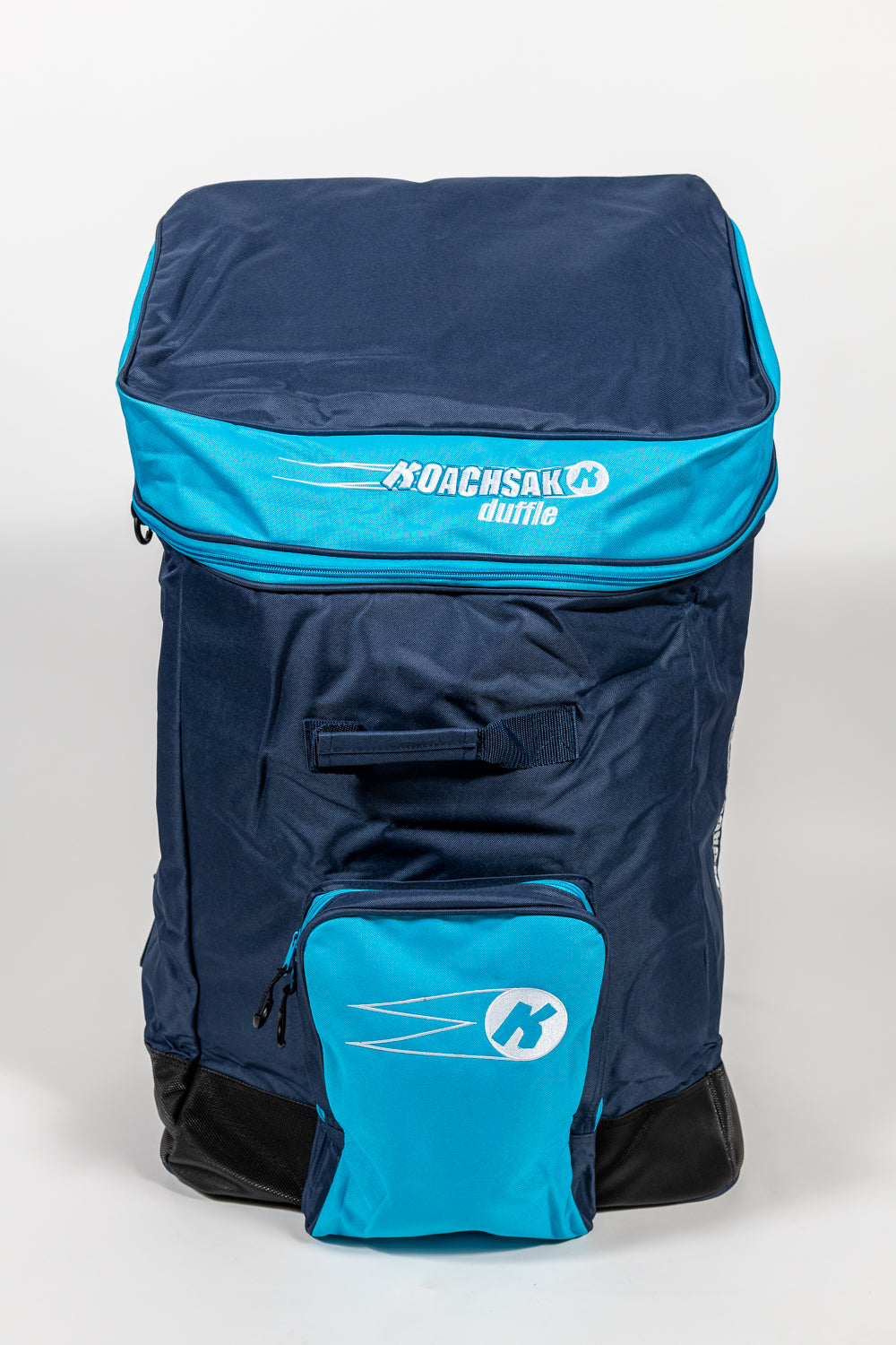 The Katchet KoachSak Duffle is a spacious navy and bright blue bag with the Katchet logo on the top flap, rucksack-style handles, zippered front pocket, and water-resistant material, shown upright against a plain white background.
