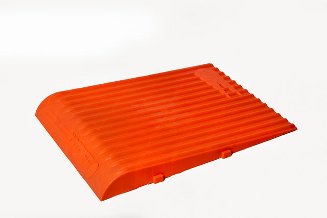The Katchet Training Aid by Katchet is a bright orange, rectangular plastic ramp with a ribbed surface and curved edge, designed to improve cricket fielding or catching skills, shown on a plain white background.