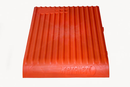 The Katchet Training Aid by Katchet is an orange, rectangular, ribbed plastic tool ideal for cricket fielding and catching practice, featuring the brand's name embossed on its front edge and shown against a white background.