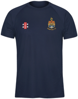 The Gray Nicolls Kempton CC Matrix V2 T Shirt in navy blue features an embroidered club logo and cricket crest on the chest, with a small red, white, and black training emblem by the left shoulder.