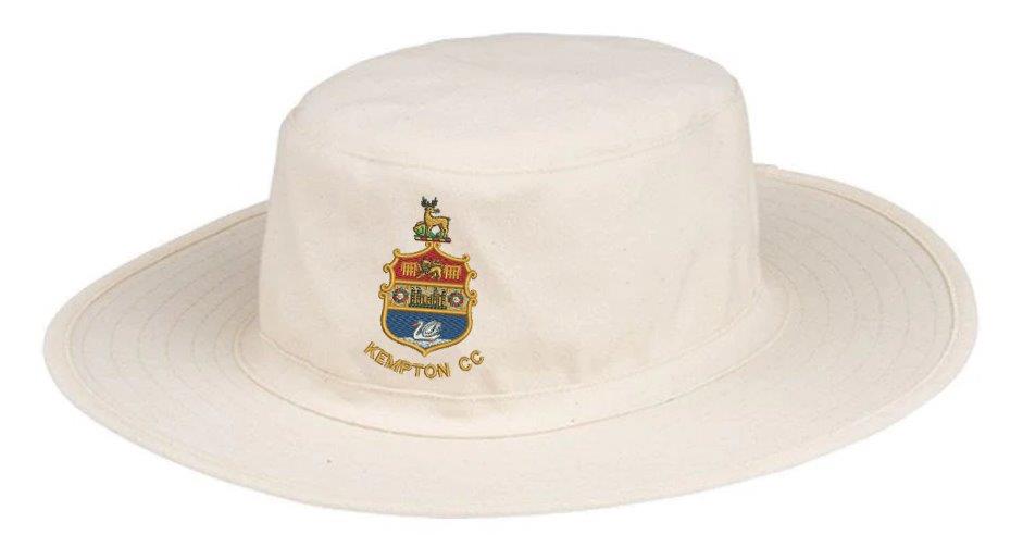 The Kempton CC Fielders Sun Hat by Hunts County is a cream-colored, wide-brimmed sun hat with an embroidered shield crest and "KEMPTON CC" text—ideal for cricket enthusiasts seeking stylish club logo protection.