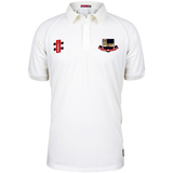 The Gray Nicolls Kings School Matrix V2 S/S Cricket Match Shirt is a white short-sleeve shirt with a collar, two embroidered chest logos, and a buttoned neckline, displayed on a plain white background.
