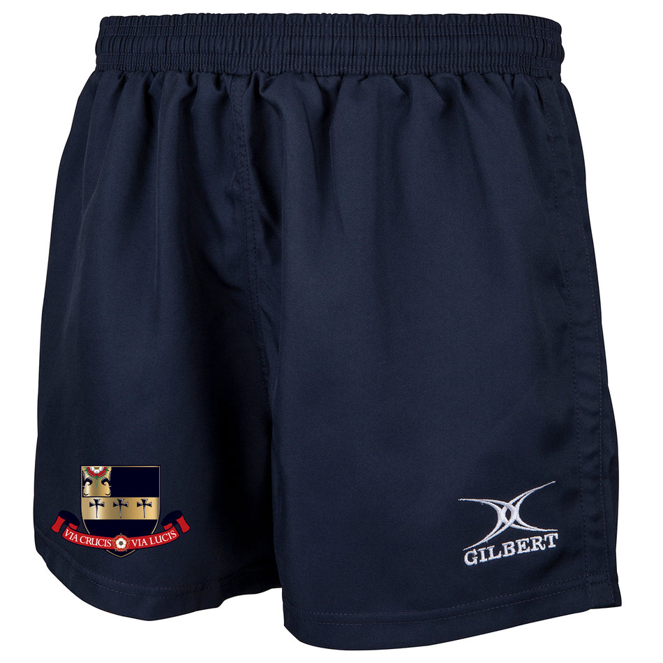 The Kings School Saracen Short by Gilbert is a navy rugby short with an embroidered school crest on the left leg and a white Gilbert logo on the right. It features an elastic waistband, loose fit, and reinforced seams for extra durability.