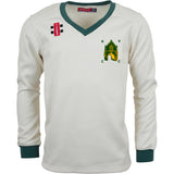 The Kingswood Village CC Pro Performance Sweater by Gray Nicolls is a cream, long-sleeved top with green cuffs and collar, lightweight bonded fabric, a church and “KVCC” on the left chest, plus a red logo with black and white squares on the right shoulder.