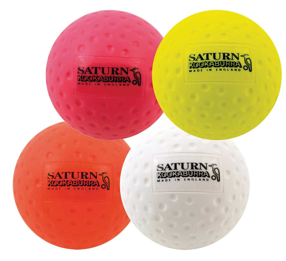 The Kookaburra Dimple Saturn Hockey Ball, available in pink, yellow, orange, and white, is ideal for school games or training sessions. Each ball features a dimpled surface and is branded with "SATURN KOOKABURRA MADE IN ENGLAND.