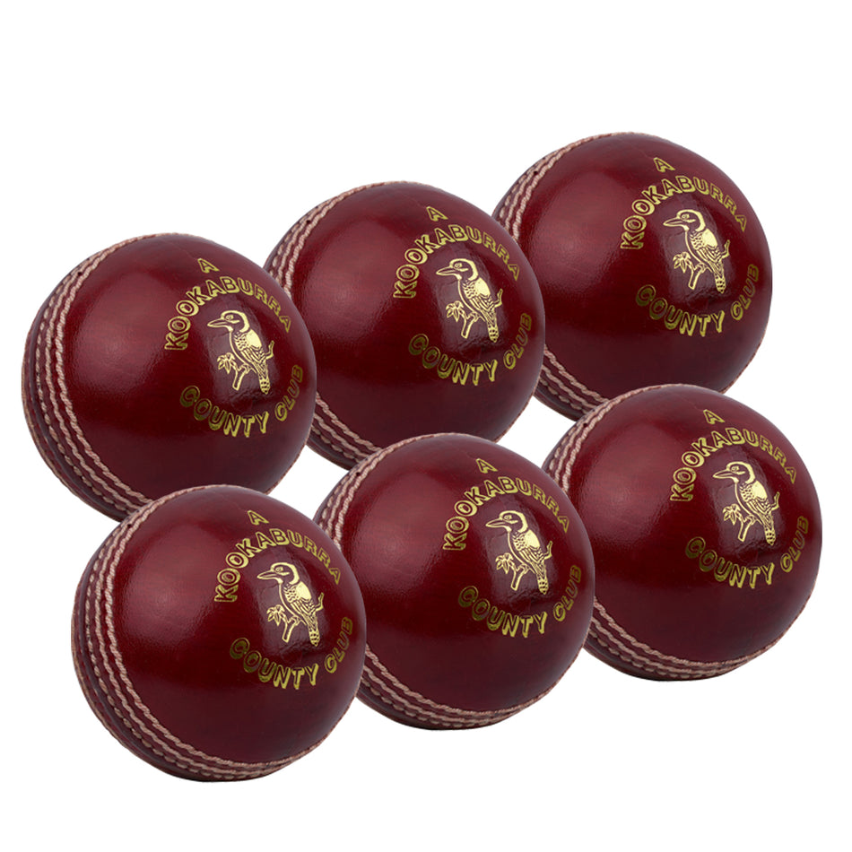 Six Kookaburra County Club Red cricket balls with white stitching and gold branding are neatly arranged in two rows on a white background.