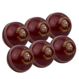 The Kookaburra County Star Red 6 Pack cricket balls, with white stitching and gold branding, are displayed in two rows against a crisp white background.