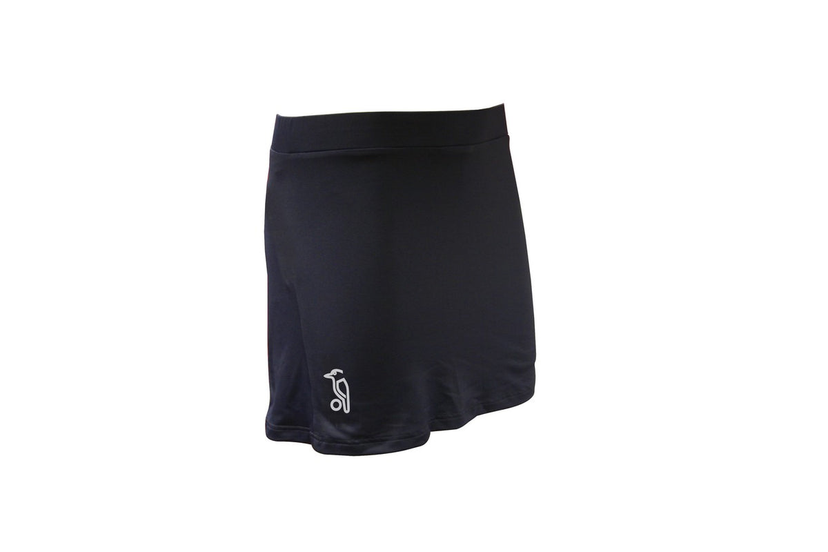 The Kookaburra Minerva Skort is a plain black performance skort by Kookaburra, featuring a small white logo on the lower left, shown against a white background.