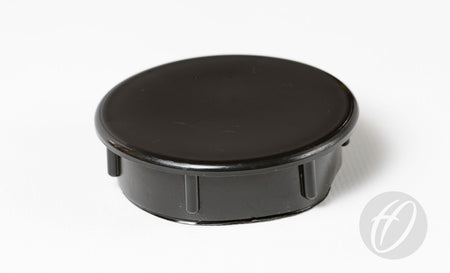 The Harrod Sport Plastic Lids for 76mm Round Sockets are black, round plastic caps with short vertical ridges, commonly used as socket lids for sports field goals.