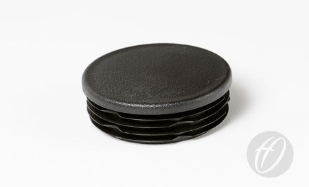The Harrod Sport Plastic Lids for 63.5mm round sockets, featuring a black, textured top and ribbed sides, are shown on a white background—ideal as drop-in caps for rugby post lids.
