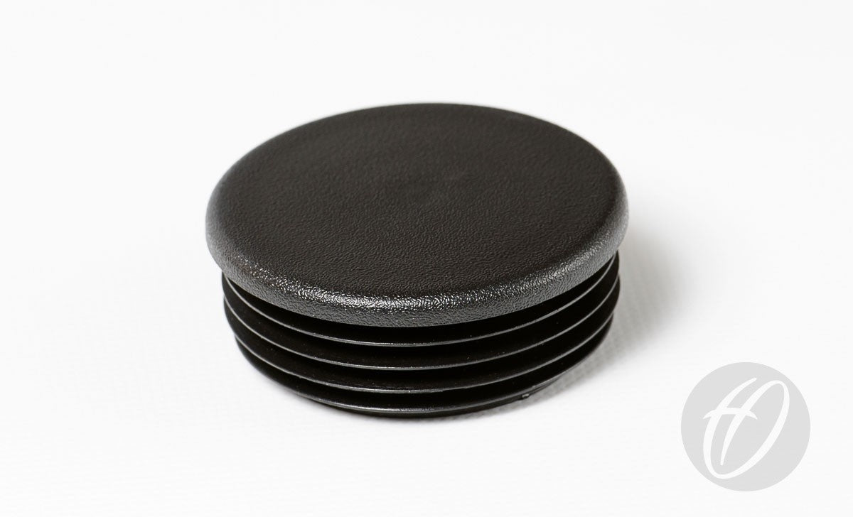 A Harrod Sport Plastic Lid for 60mm round sockets, made of black ribbed plastic and typically used for football post sockets, is shown on a white surface. A grey circular Harrod Sport logo appears at the bottom right.