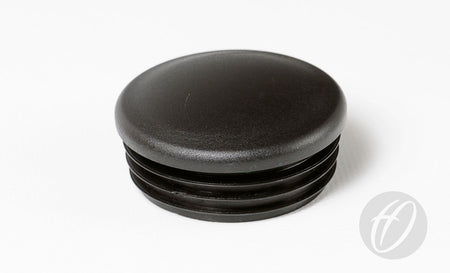 The Harrod Sport Rugby Socket Lid - 63mm Sockets is a black, round lid with a smooth top and ribbed sides, perfect for finishing off your rugby pitch equipment.
