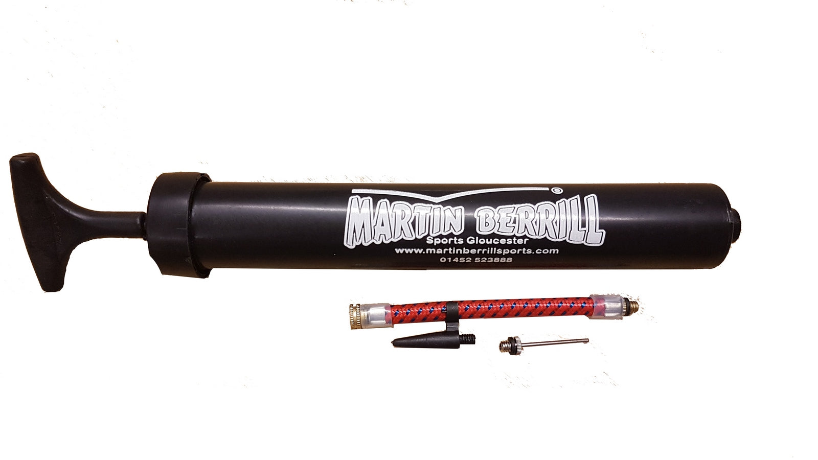 A Martin Berrill Sports Ball Hand Pump in black is shown on a white background, with a red and silver flexible inflation tube and two small metal needle adapters.