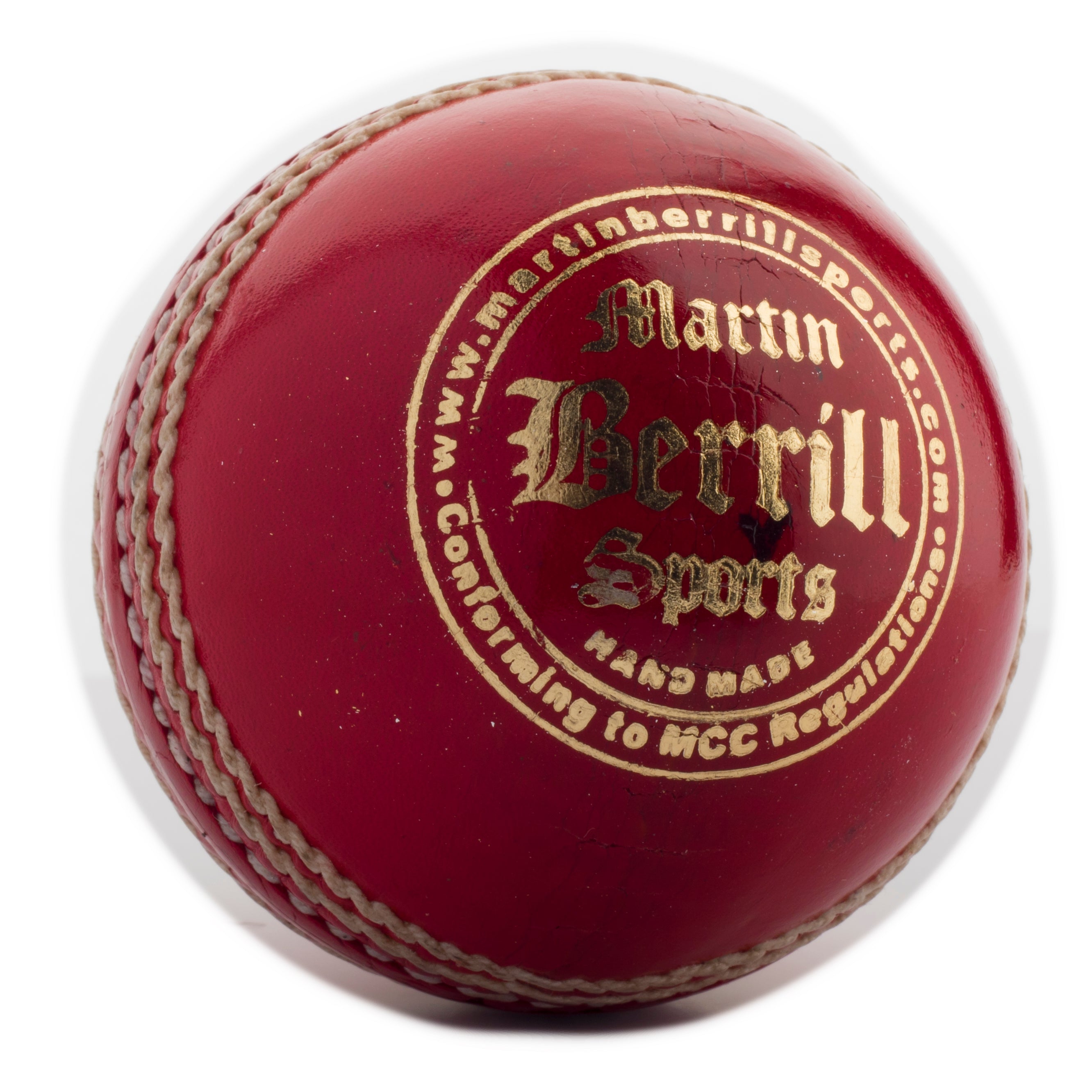 A close-up of the MBS Supreme Crown Cricket Ball, handcrafted from leather with prominent white stitching and gold Martin Berrill Sports branding, plus additional writing along the top edge.