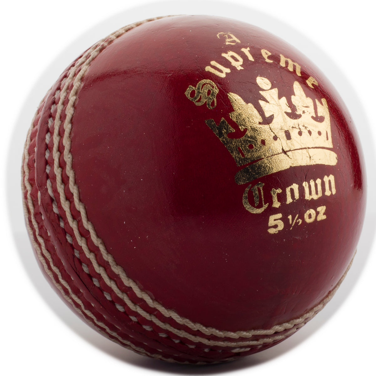 The MBS Supreme Crown Cricket Ball by Martin Berrill Sports is a red leather ball with white stitching, a gold crown logo, and weighs 5½ oz.