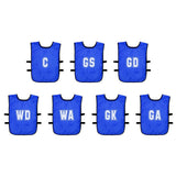 The Precision Training Mesh Netball Training Bibs (Pack of 7) feature blue bibs with white position labels—C, GS, GD, WD, WA, GK, GA—and black side straps, ideal for any netball training session.