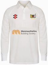 The Gray Nicolls Monmouth CC Junior Smaller Sizes Matrix V2 Long Sleeve Shirt is a white, moisture-wicking cricket top with the Monmouthshire Building Society logo, club crest, and two sponsor logos on the chest for comfort and style.