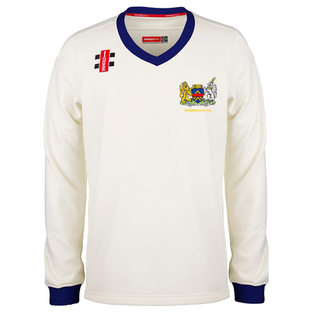 The Gray Nicolls Monmouth CC Larger Sizes Junior Pro Performance Sweater features long sleeves, blue cuffs and collar, the club crest on the chest, plus logo details—perfect for junior players seeking a pro look.