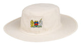 The Monmouth CC Junior Fielders Sun Hat by Martin Berrill Sports is an off-white, wide-brimmed hat featuring a colorful coat of arms with a lion and unicorn flanking a shield on the front.