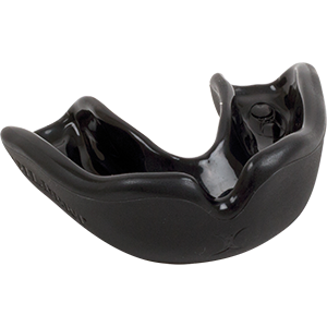The Grays Academy Mouthguard is a red, entry-level boil and bite sports mouthguard from Grays. It fits over the upper teeth with contoured edges and a central breathing channel, displayed against a plain white background.