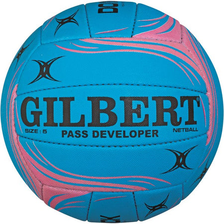 The Gilbert Pass Developer Netball by Gilbert is a blue, size 5 training ball with pink swirl designs, black star-like patterns, and "GILBERT PASS DEVELOPER NETBALL SIZE: 5" printed in black.