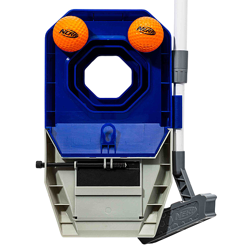 The Nerf Trick Shot Golf Set by Nerf features a blue and gray plastic base with a hexagonal hole, two orange foam golf balls on top, and a small black and gray adjustable putter attached to the side.