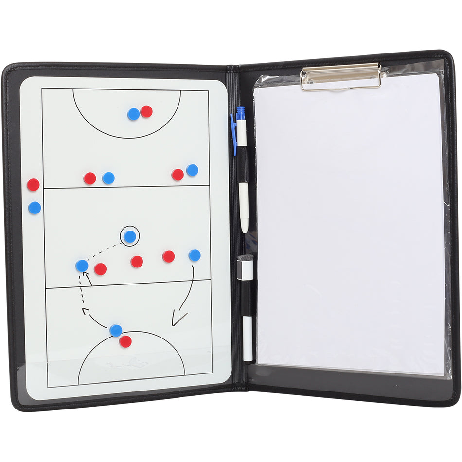 An open Gilbert Netball Coaching Manual shows a magnetic netball board with magnets and arrows on the left, plus a blank notepad and dry erase pen on the right—ideal for coaches. Brand: Gilbert.