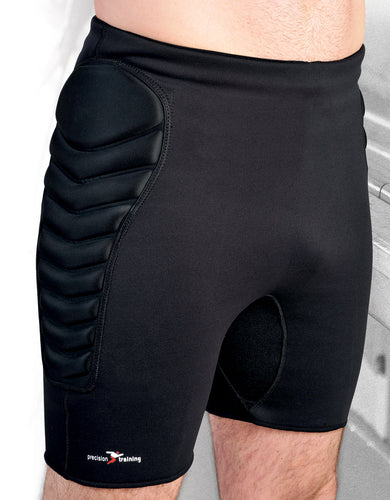A person wears Precision Training Neoprene Padded Goalkeeping Shorts, featuring reinforced padding on one thigh and a small Precision Training logo near the hem for goalkeeper protection during sports or training.