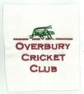 The Gray Nicolls Overbury CC Melton County Cap features a white patch with a bottle green cricket insect above "OVERBURY CRICKET CLUB" in maroon, framed by maroon lines—ideal for senior players.