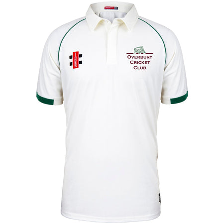 The Overbury CC Matrix V2 Short Sleeve Match Shirt by Martin Berrill Sports is a white polyester cricket top with green sleeve trim, featuring the club logo and text on the left chest and a red-and-black patch on the right.