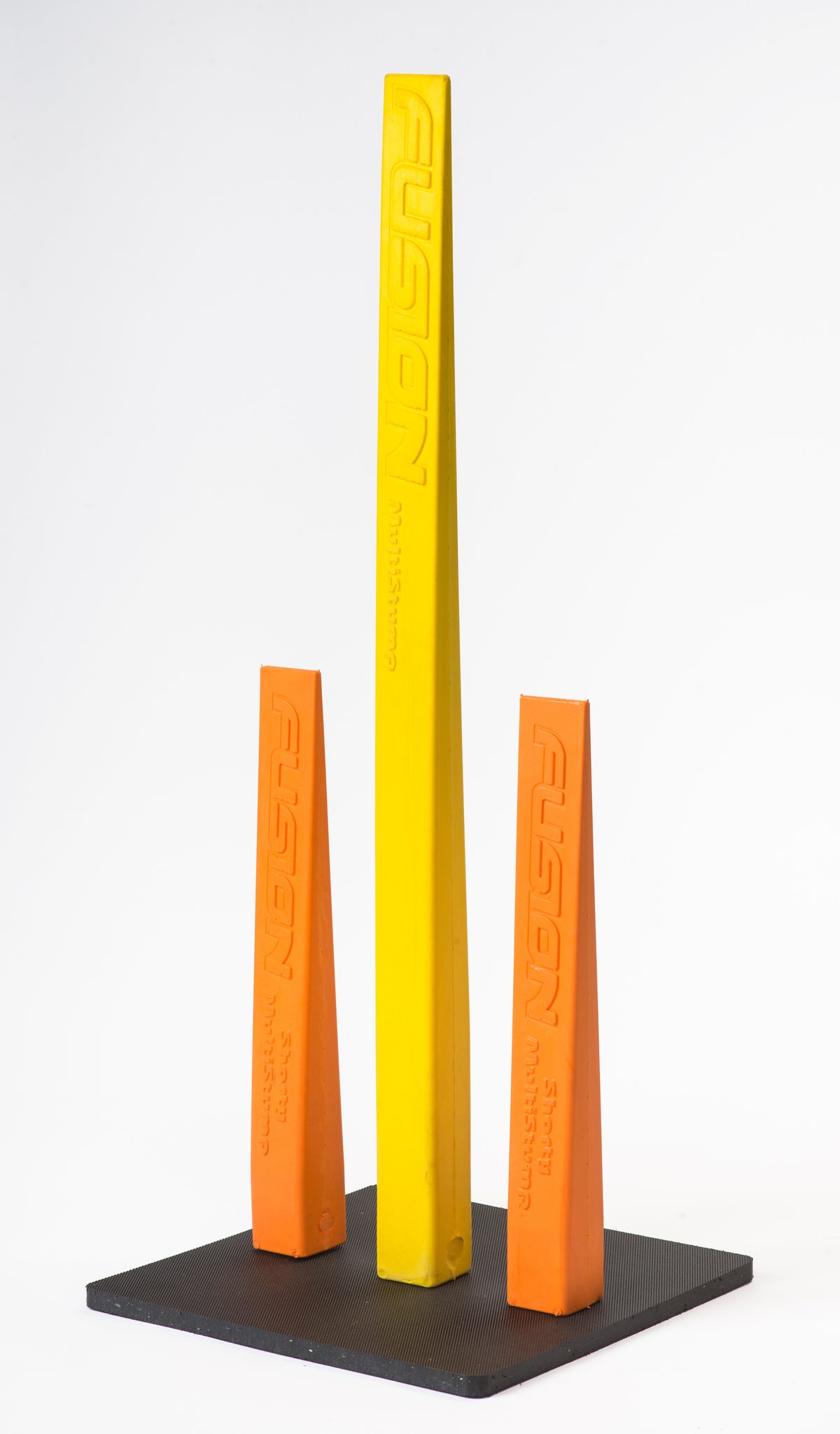 Three upright Fusion Multi-Stump Shorty blocks—two orange, one taller yellow—stand on a black base. Each block has "FUSION" embossed vertically. The background is white and the product is by Fusion.