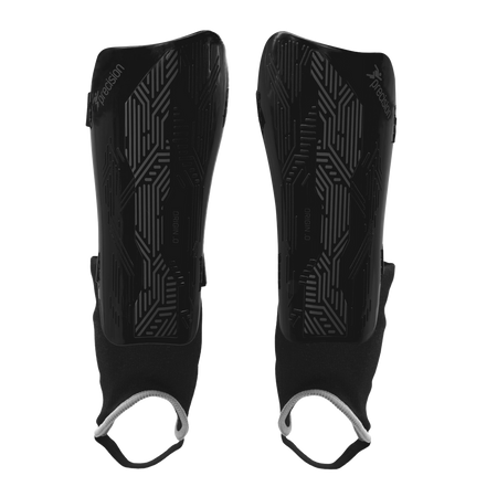 The Precision Training Precision Origin.0 Shin & Ankle Guards in Black/Black feature geometric patterns and black fabric sleeves with white elastic foot loops for football protection, shown on a white background.