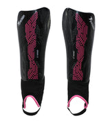 The Precision Training Origin.0 Shin & Ankle Guards in black/pink feature pink geometric patterns, white Precision branding, and pink-trimmed elastic ankle guards. Both are shown side by side on a white background.