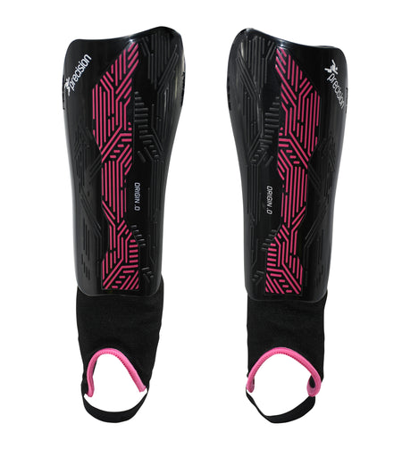 The Precision Training Origin.0 Shin & Ankle Guards in black/pink feature pink geometric patterns, white Precision branding, and pink-trimmed elastic ankle guards. Both are shown side by side on a white background.