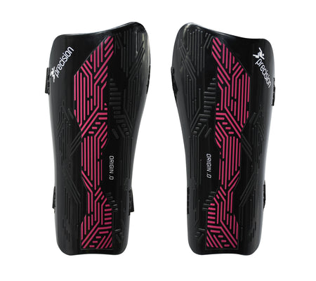 The Precision Training Origin.0 Strap Shin Guards in Black/Pink feature a geometric pink pattern and ORIGIN 0 label, offering high-impact protection with lightweight design, displayed against a white background.