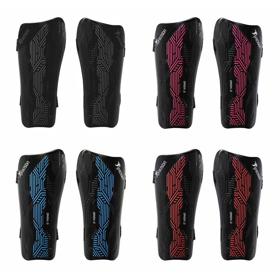Eight pairs of Precision Training Precision Origin.0 Strap Shin Guards are shown: the top row is black with gray or pink patterns, while the bottom row displays black guards with blue or red geometric designs. All offer lightweight, high-impact protection.