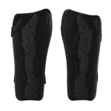 The Precision Training Origin.0 Strap Shin Guards in Black/Black feature geometric patterns and "Precision" branding, delivering a lightweight design and high-impact protection.