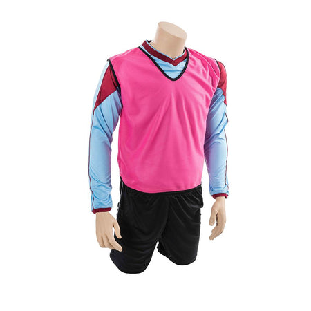 A headless mannequin kneels wearing the Precision Training Mesh Training Bib in pink over a light blue and burgundy long-sleeve shirt, paired with black athletic shorts.