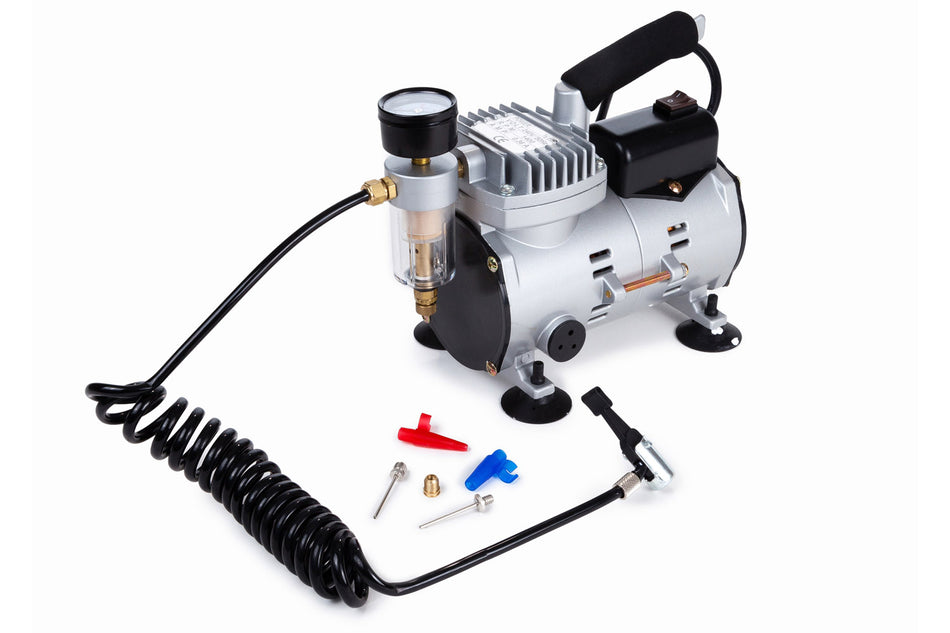 The Samba Sports Samba Electric Ball Pump, a compact mains-powered compressor with pressure gauge, black coiled hose, and assorted nozzles and adapters—ideal for inflating balls—is displayed on a white background.