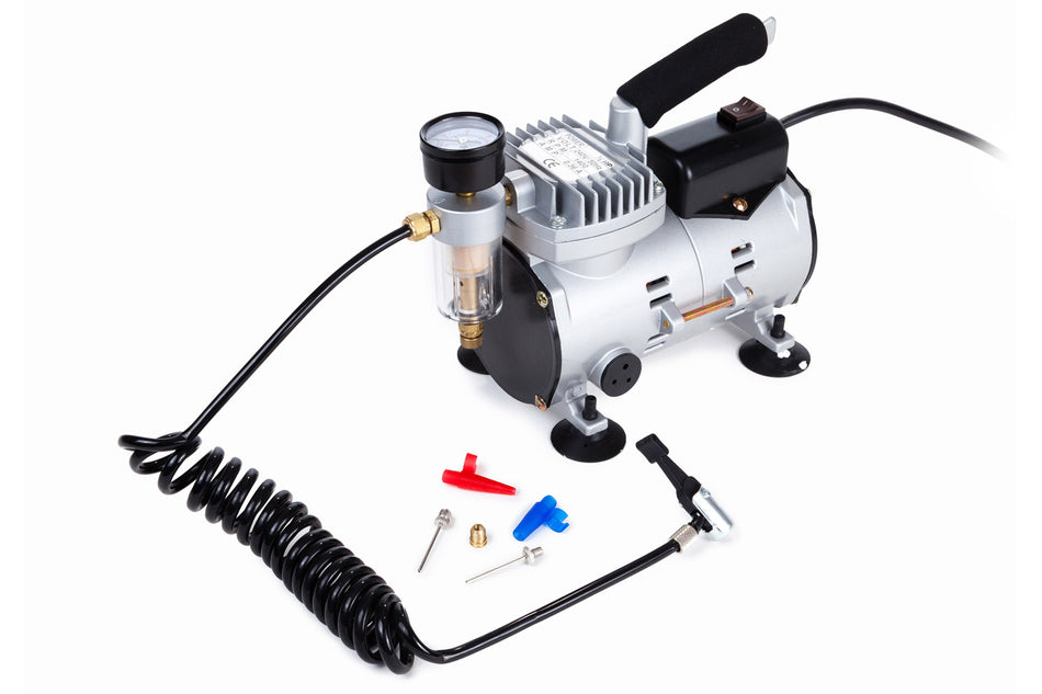 The Samba Sports Samba Electric Ball Pump is a compact silver and black 240V air compressor featuring a pressure gauge, coiled air hose, and assorted nozzle attachments in various shapes and colors displayed on a white background.